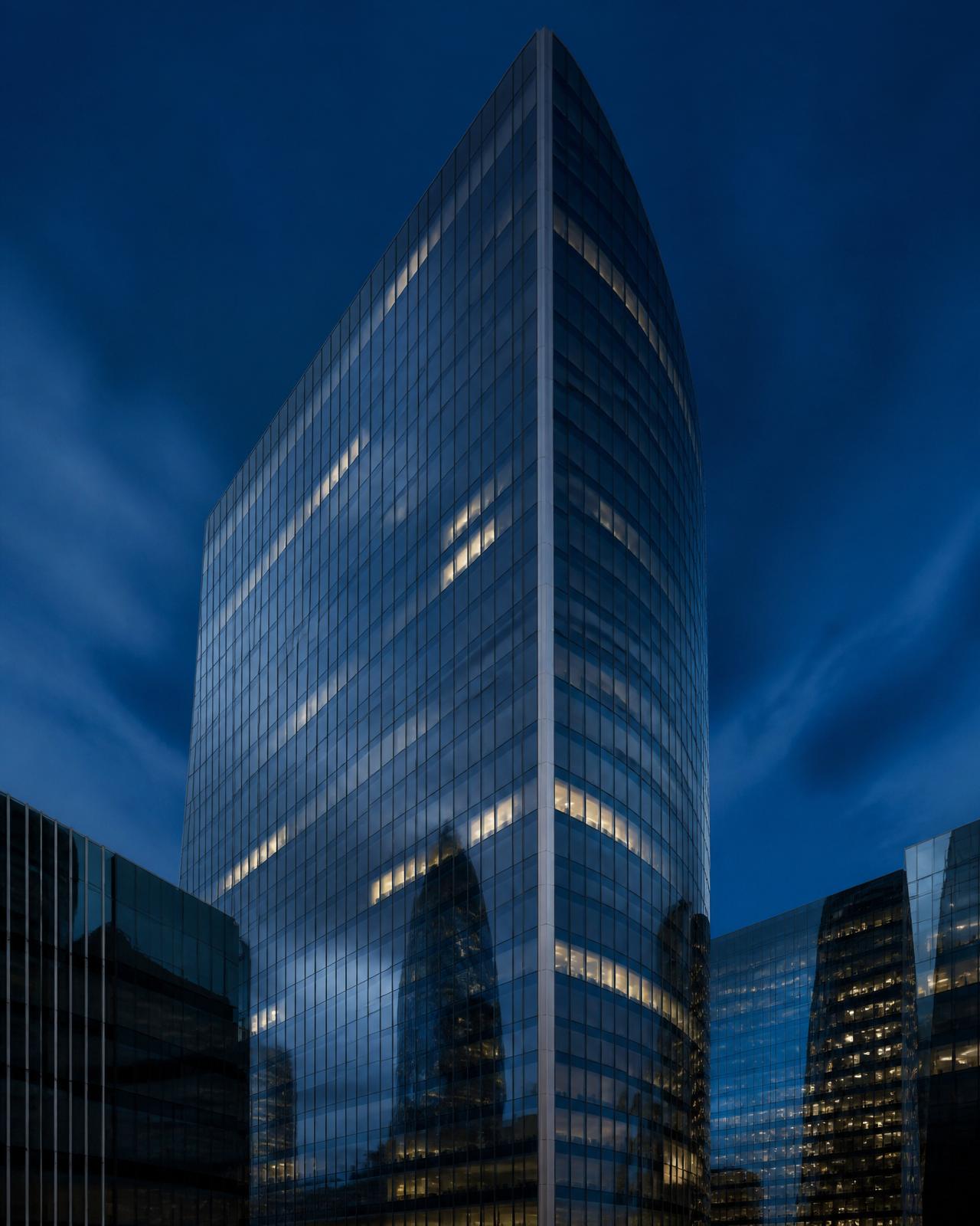 Modern City of London office tower at blue hour